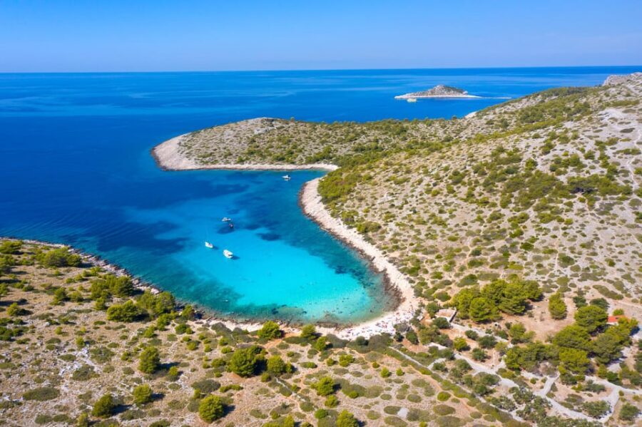 From Zadar: Kornati National Park & Telašćica Boat Tour - The onboard food: breakfast roll, grilled lunch, and wine with a plain-spoken approach