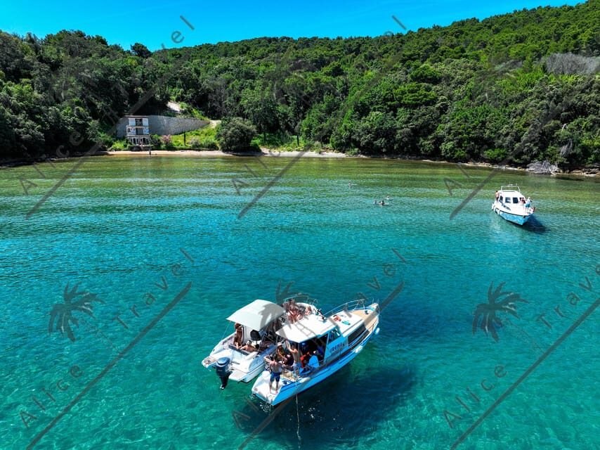 Zadar: Speedboat Escapade 3 stops & Snorkeling & Local Wine - Preko: island shops, a sandy beach, and snorkeling again